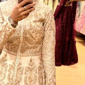 Rimple and Harpreet gown , ivory with gold and silver thread and a cancan skirt